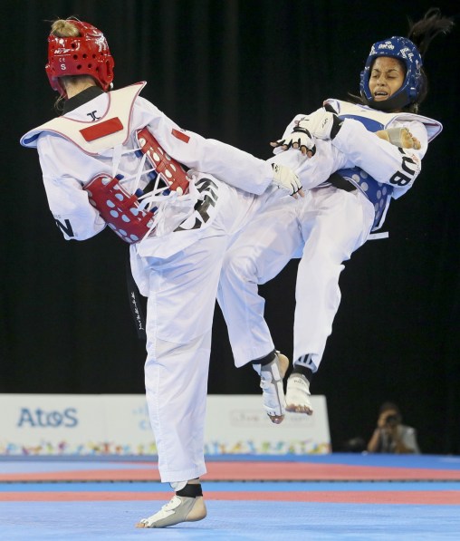 Evelyn Gonda (red) of Maple Ridge, B.C. lost to Yamicel Nunez of Cuba in Taekwondo semifinals at the Pan American Games in Mississauga, Ontario Monday, July 20, 2015 (Photo by Mike Ridewood/COC)