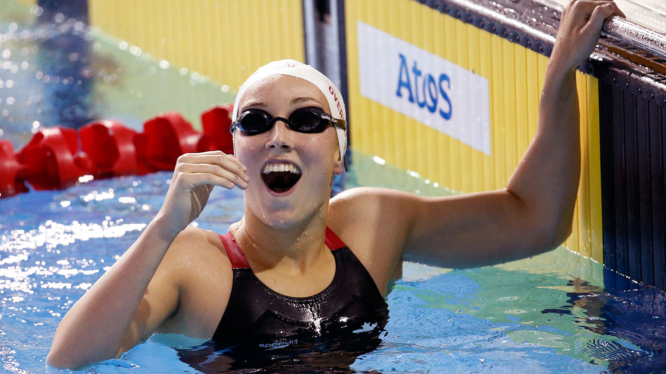 Canada's Emily Overholt is overjoyed after swimming to gold in the women's 400m freestyle at TO2015 Pan Am Games.