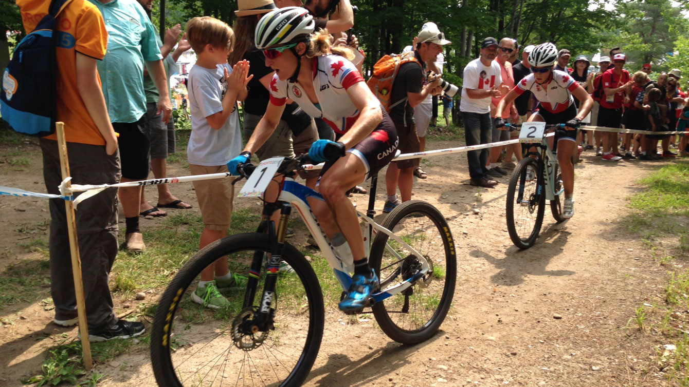 Catharine Pendrel is chased by Emily Batty as the two Canadians race ahead of the crowd at Pan Am Games on July 12, 2015.