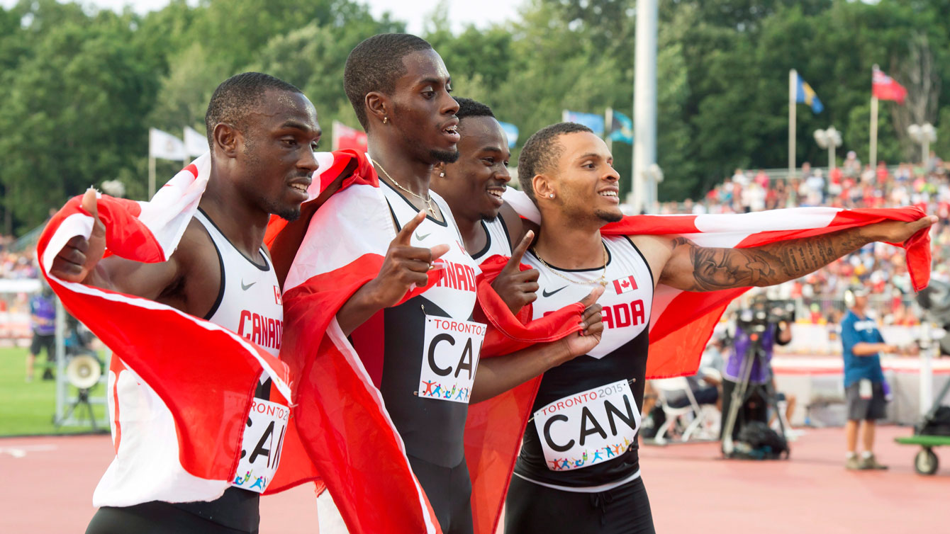 Gavin Smellie (left) ran the first leg for Canada in the men's 4x100m final at the Pan Am Games on July 25, 2015.