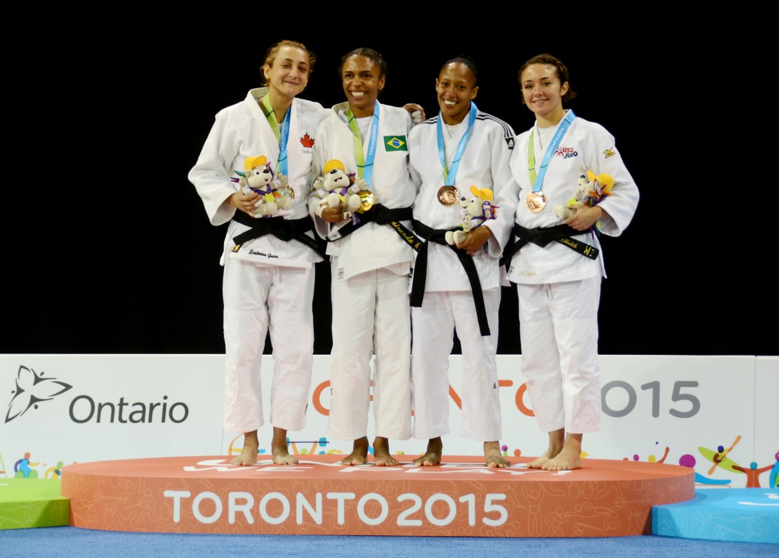 Ecaterina Guica, Erika Miranda, Gretter Romero, and Angelica Delgado on the podium