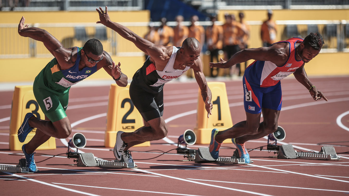 Damian Warner takes off in the 100m to start his events in the Pan Am Games decathlon on July 22, 2015 in Toronto.