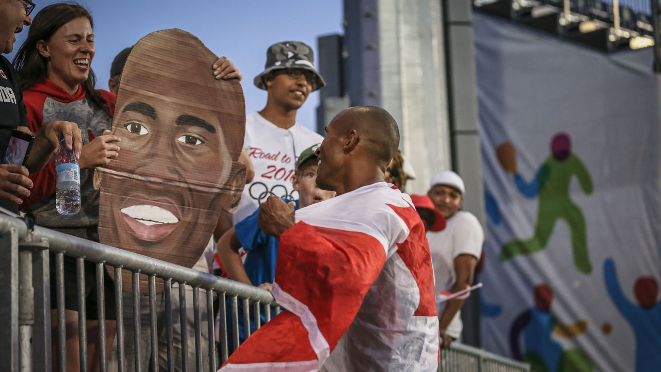 Damian Warner with friends and family after winning the decathlon at the Pan Am Games in Toronto on July 23, 2015.