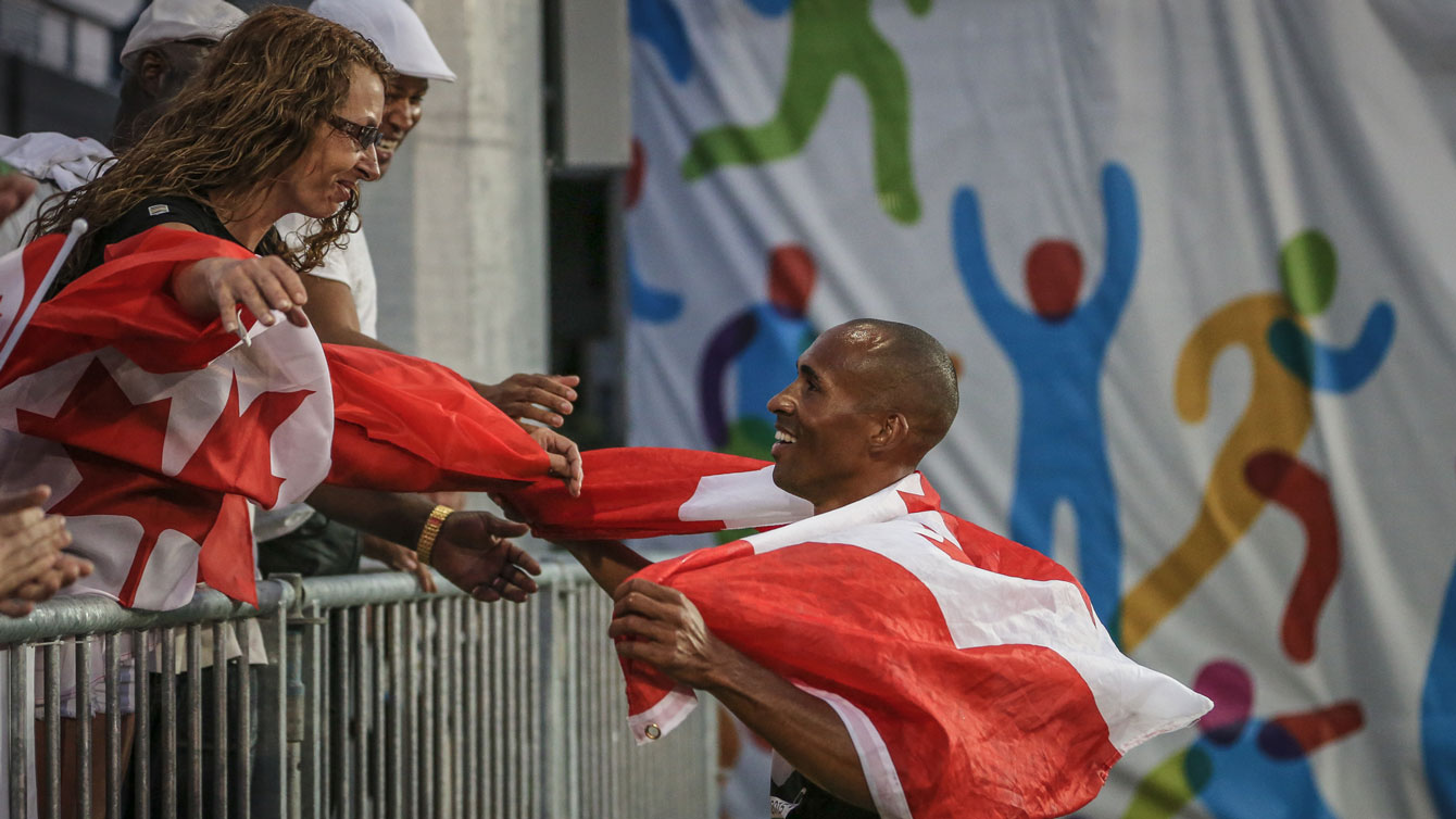 Damian Warner with friends and family after winning the decathlon at the Pan Am Games in Toronto on July 23, 2015.