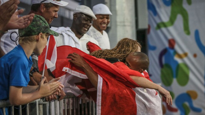 Damian Warner hugs his mother after winning the decathlon at the Pan Am Games in Toronto on July 23, 2015.