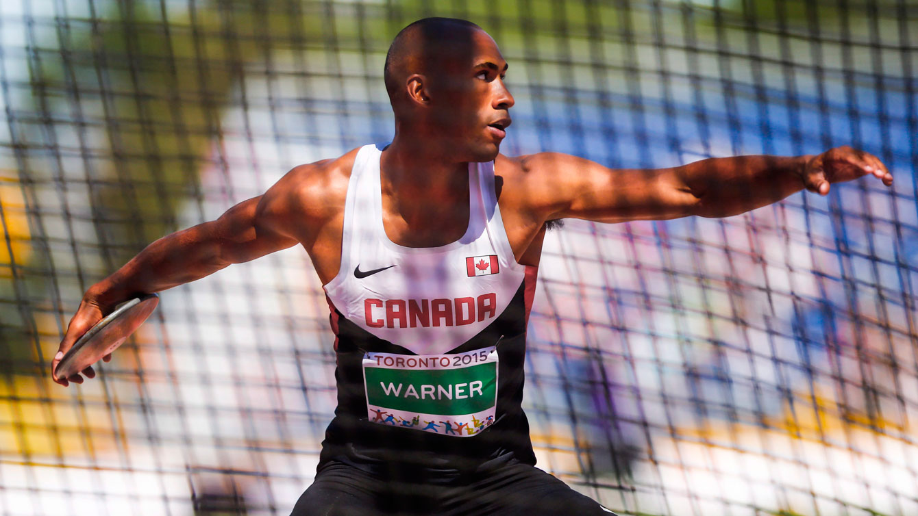 Damian Warner in the process of launching the discus at the Pan Am Games on July 23, 2015 as part of the decathlon.