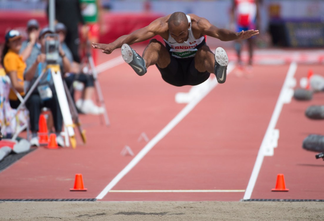 Damian Warner takes flight in the long jump portion of decathlon at Toronto 2015 Pan American Games.