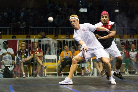 Canada's Andrew Schnell competes against Mexico's Eric Galvez in the men's team squash gold medal event at the 2015 Pan American Games in Toronto, Canada (COC Photo by Winston Chow).