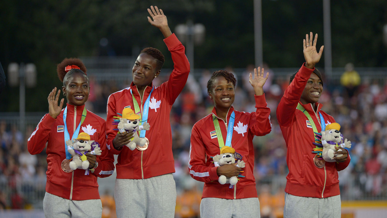 Canadian women's relay team receive their 4x100m bronze medal at the Pan Am Games in Toronto on July 25, 2015.