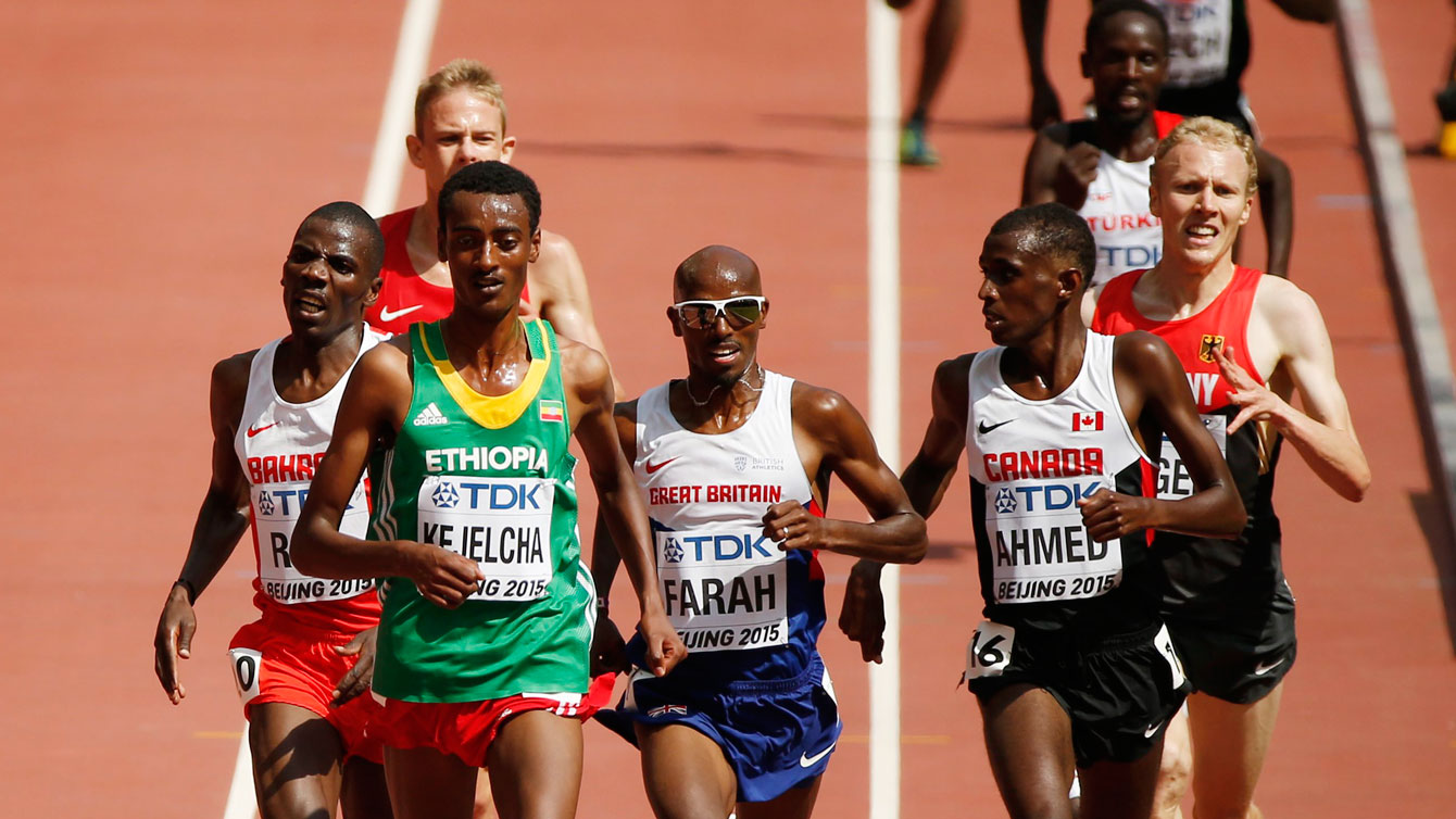Mo Ahmed looks over at British legend Mo Farah's direction toward the final moments of their 5,000m heats at the IAAF World Championships in Athletics on August 26, 2015 in Beijing, China.