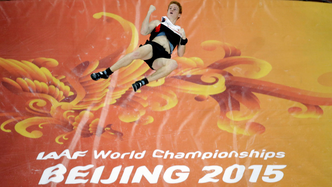Shawn Barber celebrates mid-air after clearing the bar during one of his jumps at the IAAF World Championships in Athletics on August 24, 2015 in Beijing, China.