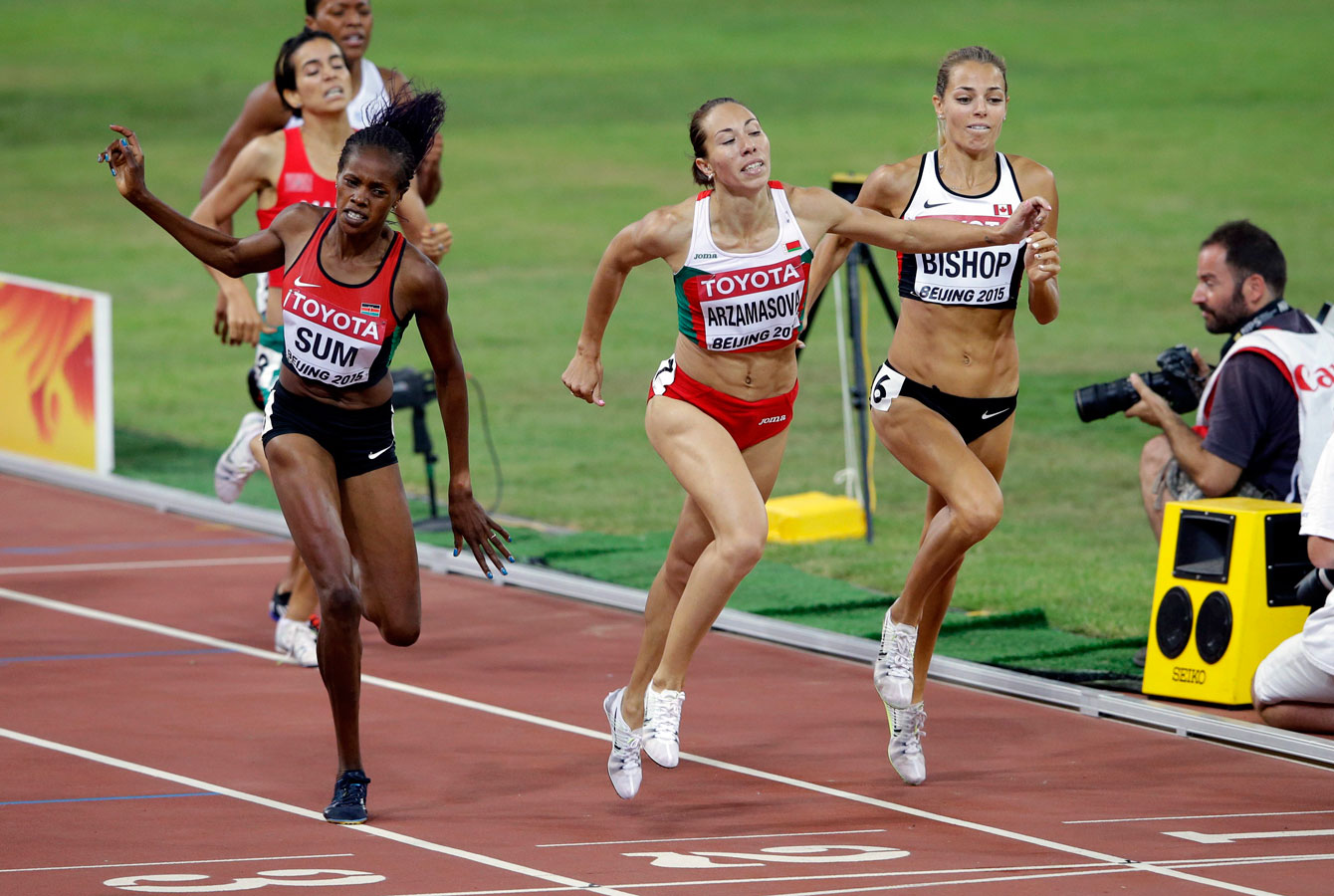 Bulgaria's Marina Arzamasova (centre) leans in ahead of Canada's Melissa Bishop (right) and Kenya's Eunice Sum at the IAAF World Championships in Athletics women's 800 metres final on August 29, 2015.