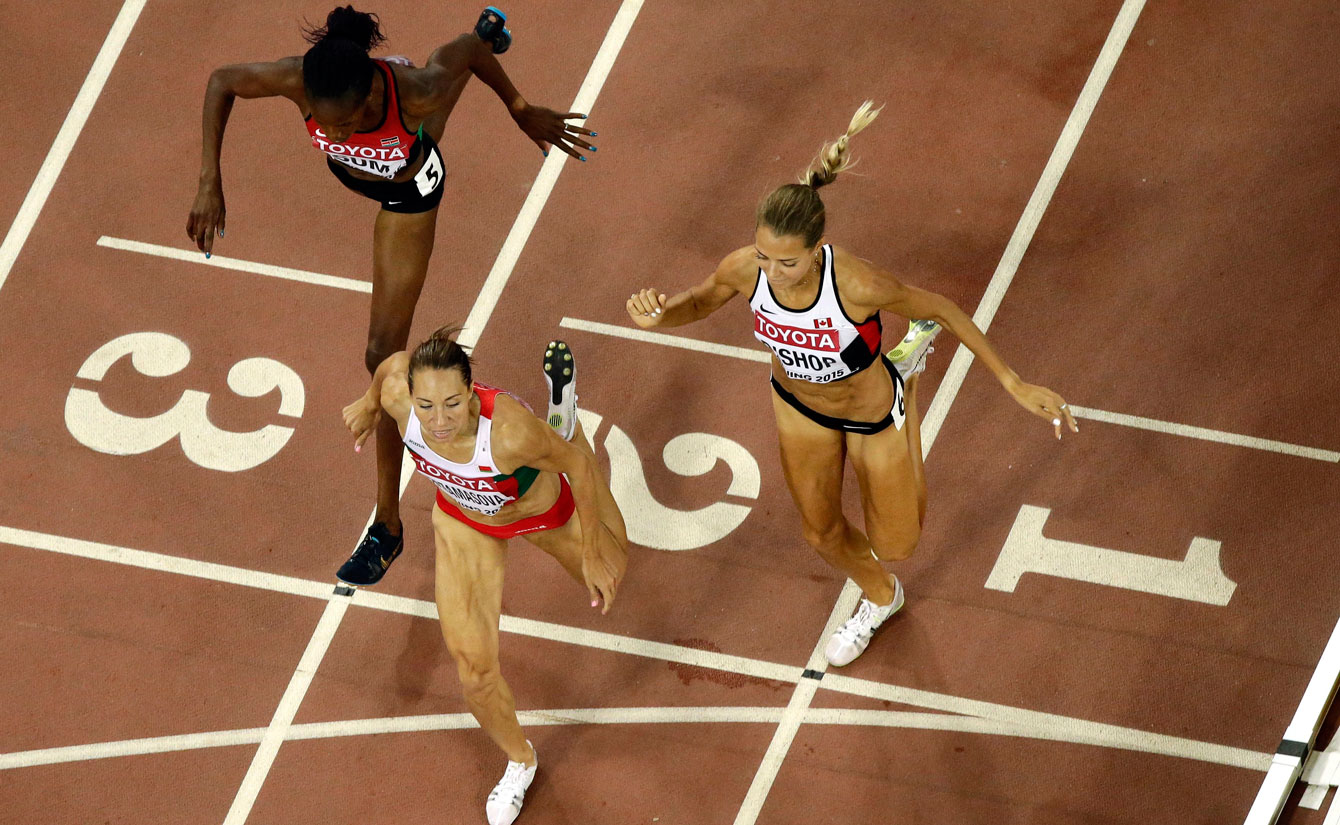 Bulgaria's Marina Arzamasova (centre) leans in ahead of Canada's Melissa Bishop (right) and Kenya's Eunice Sum at the IAAF World Championships in Athletics women's 800 metres final on August 29, 2015.