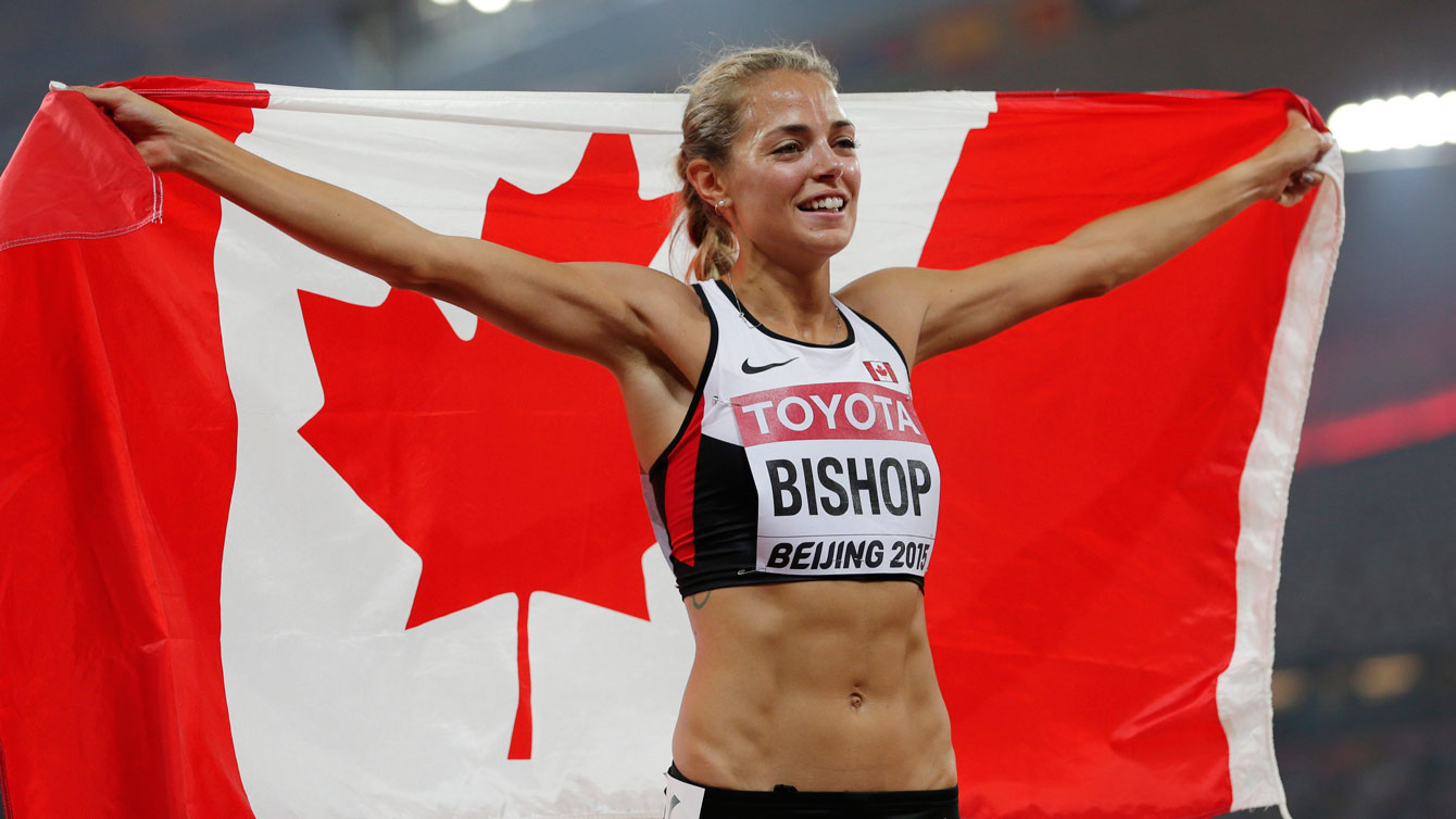 Melissa Bishop celebrates with the flag after winning 800m silver at the world championships in Beijing on August 29, 2015.