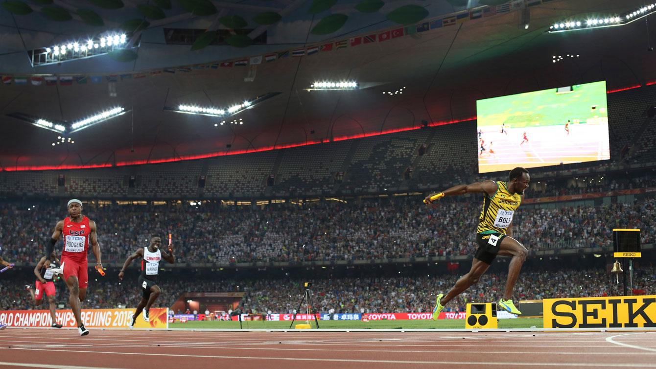 Usain Bolt crosses the finish line first for Jamaica in men's 4x100m relay with Mike Rodgers (USA) and Justyn Warner (Canada) chasing at the world championships in athletics on August 29, 2015.