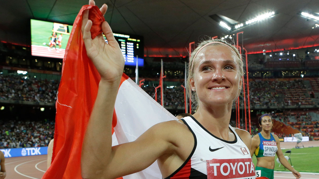 Brianne Theisen-Eaton with the maple leaf following her silver medal performance in heptathlon at the IAAF World Championships in Athletics - Beijing, China on August 23, 2015.