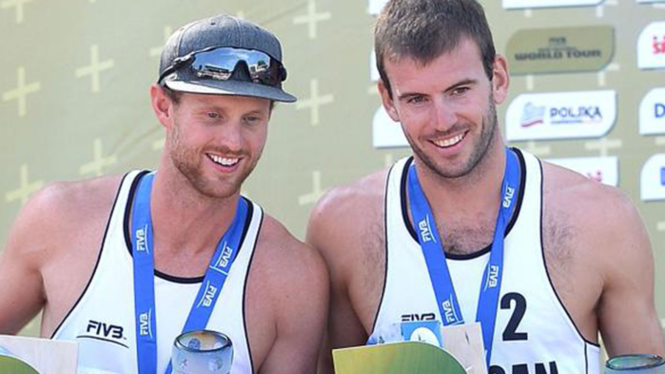 Chaim Schalk (left) and Ben Saxton receive their medals and cheque at the Olsztyn Grand Slam, Sunday, August 30, 2015.