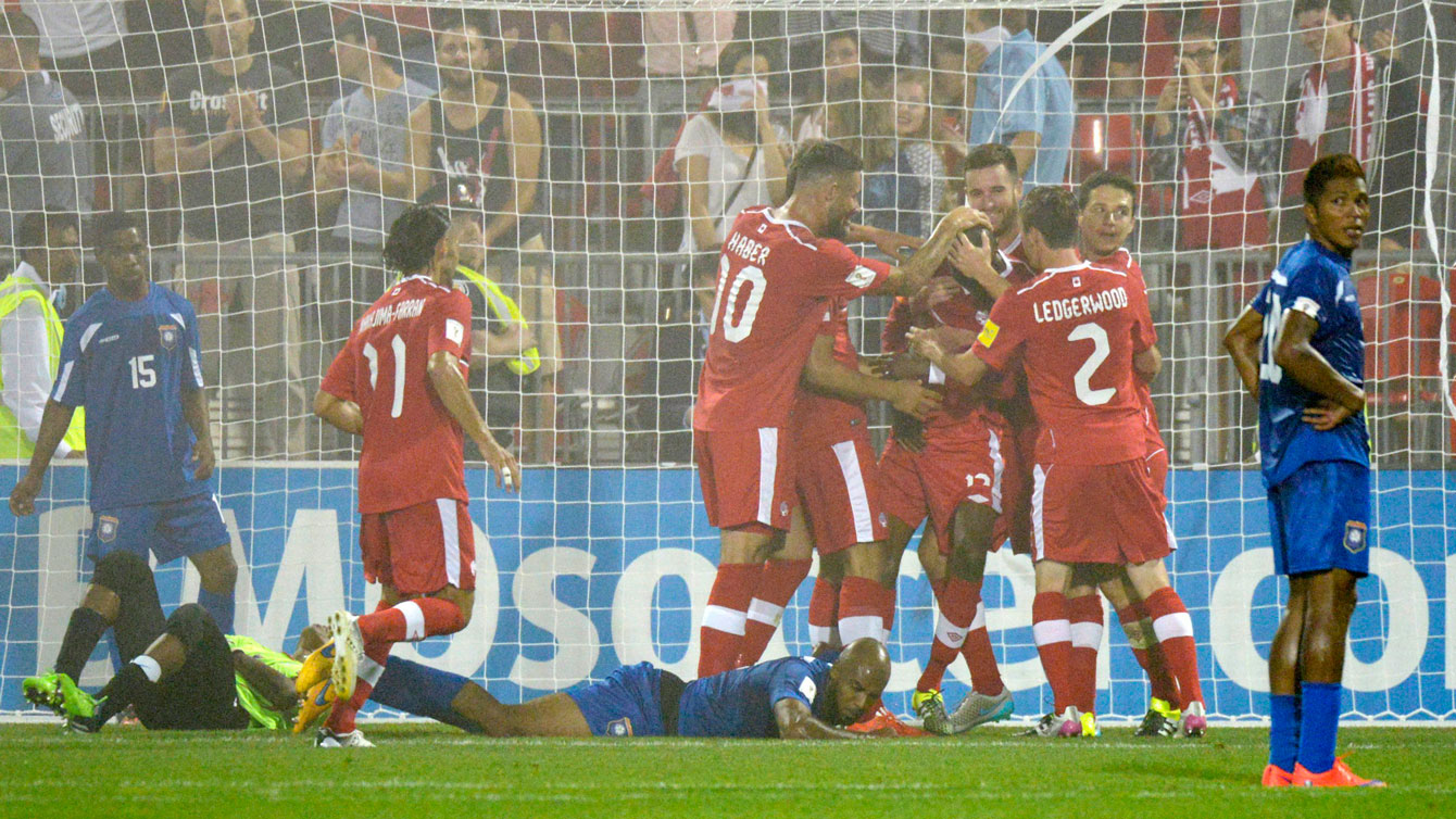 Canada celebrates Atiba Hutchinson's goal in 2018 FIFA World Cup qualifying action against Belize in Toronto on September 4, 2015.
