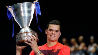 Milos Raonic holds up his St. Petersburg Open trophy after beating Joao Sousa on September 27, 2015.