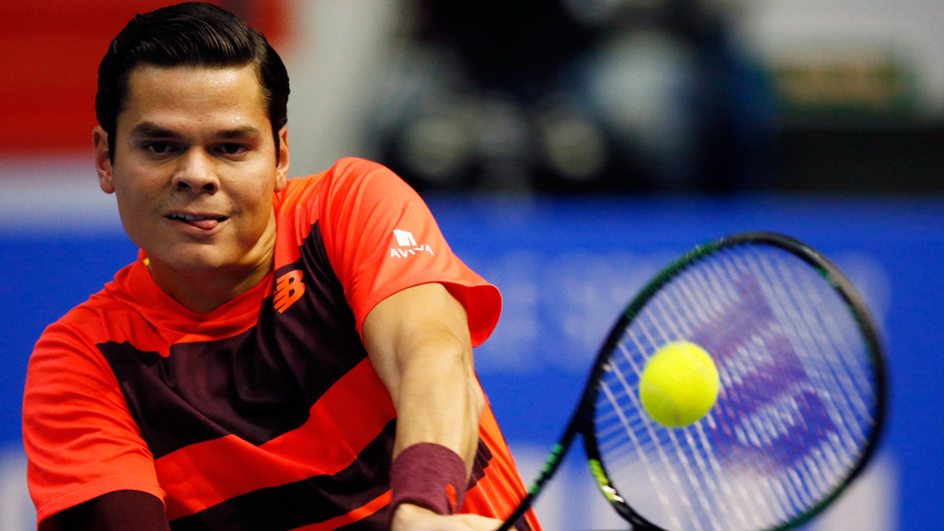 Milos Raonic returns against Roberto Bautista-Augut at the ATP 250 event in St. Petersburg, Russia on Saturday, September 26, 2015.