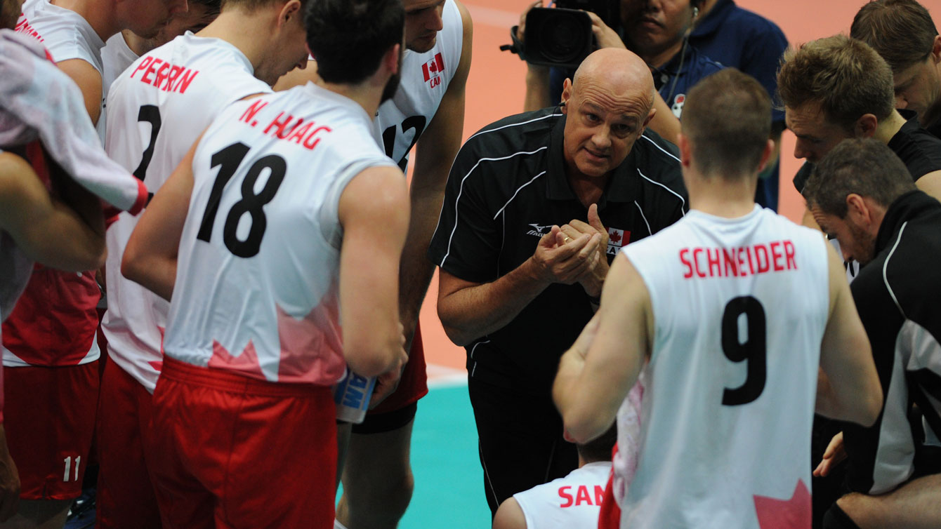 Canada head coach Glenn Hoag speaks to the team during a timeout on September 17, 2015 (Photo: FIVB).