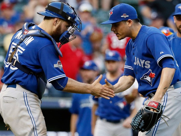 Russell Martin (left) has brought out the best in the Blue Jays' young pitchers, especially 20 year-old closer Roberto Osuna (right).
