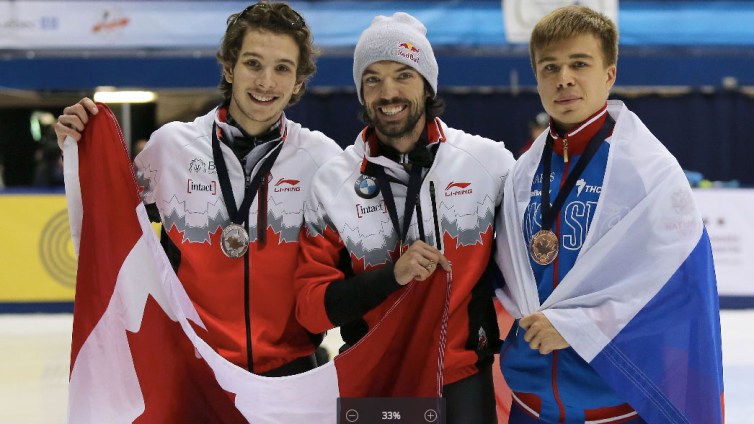 Charles Hamelin (centre) and Sam Girard (left) celebrate their Canadian 1-2 World Cup 100m finish in Montreal on November 1, 2015 (Photo: Greg Kolz).