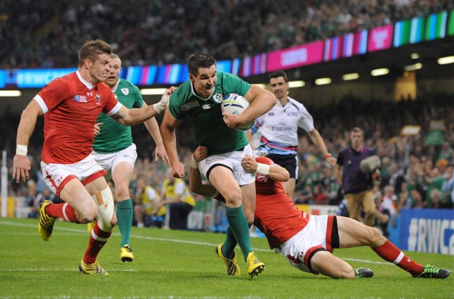 Ireland's Jonathan Sexton runs with the ball to go on to score a try against Canada during their Rugby World Cup Pool D match at the Millennium Stadium, Cardiff, Wales, Saturday Sept. 19. 2015. (AP Photo/Rui Vieira)