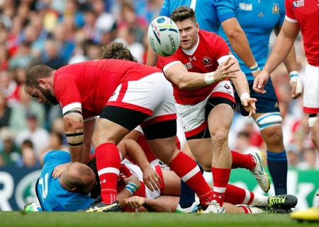 Canada's Jamie Mackenzie throws the ball during the Rugby World Cup Pool D match between Italy and Canada at Elland Road, Leeds, England, Saturday, Sept. 26, 2015. (AP Photo/Alastair Grant)