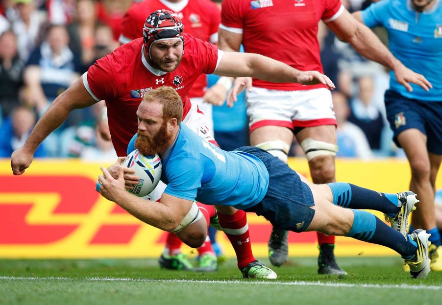 Italy's Gonzalo Garcia scores a try during the Rugby World Cup Pool D match between Italy and Canada at Elland Road, Leeds, England, Saturday, Sept. 26, 2015. (AP Photo/Alastair Grant)