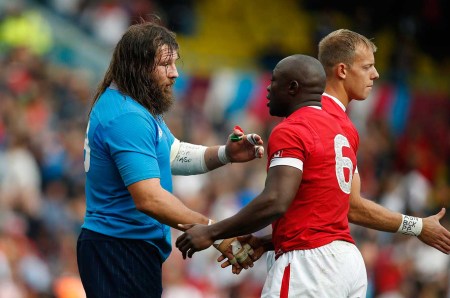 Italy's Martin Castrogiovanni, left, shakes hands with Canada's Nanyak Dala after their Rugby World Cup Pool D match at Elland Road, Leeds, England, Saturday, Sept. 26, 2015. Italy won the match 23-18. (AP Photo/Alastair Grant)