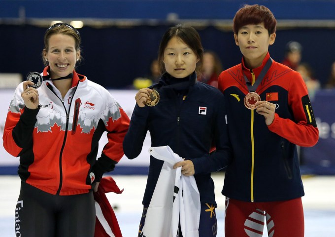 St-Gelais (left) poses with gold medallist Choi Minjeong of Korea (centre) and China's Fen Kexin (bronze).