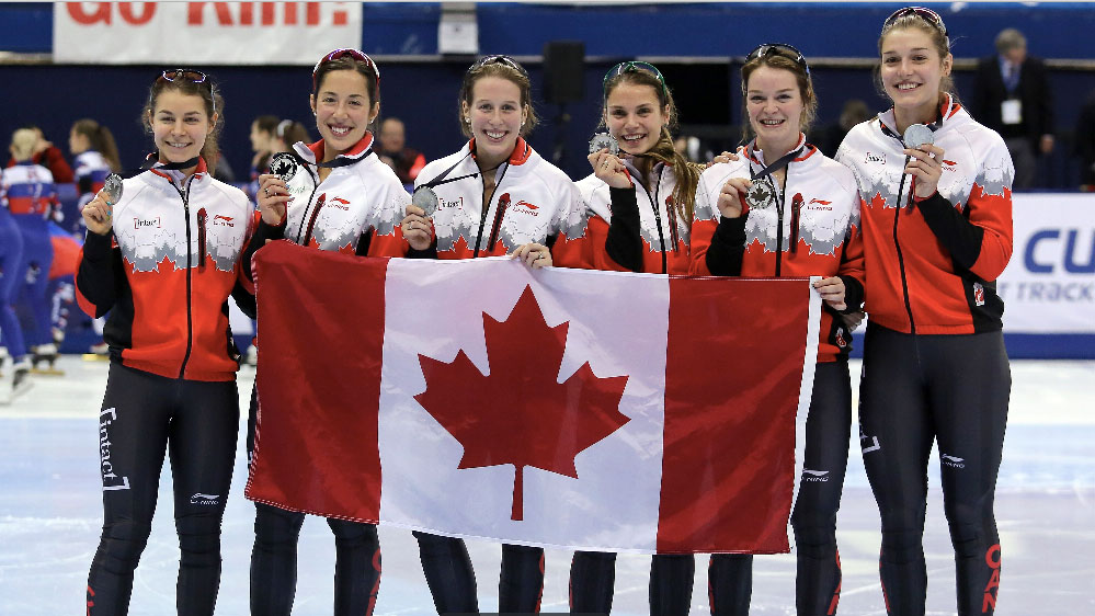 Members of the short track relay team show off their silver medal at the Montreal World Cup on November 1, 2015. 