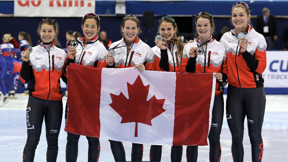 Members of the short track relay team show off their silver medal at the Montreal World Cup on November 1, 2015.