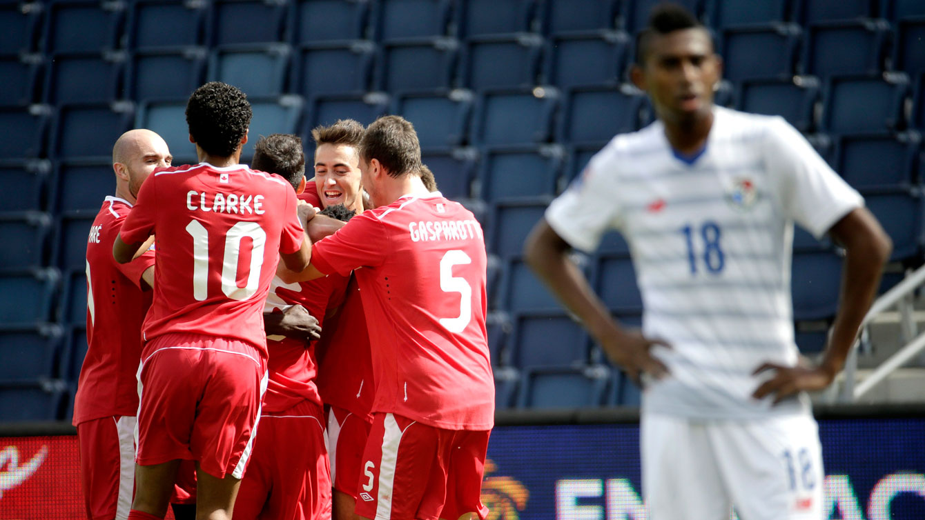 In Olympic soccer qualifying - Canada v. Panama - Canadian players in red celebrate Skylar Thomas' goal on October 3, 2015 in Kansas City, Kansas.