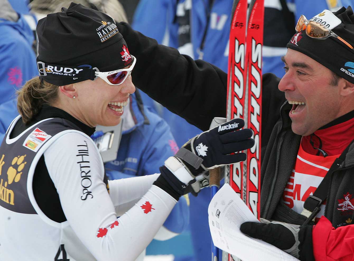 Canada's Beckie Scott celebrates her victory in the 15 km women's pursuit race at the cross country skiing World Cup races in Oberstdorf, southern Germany, Saturday, Jan. 21, 2006 with head wax technician Yves Bilodeau. (AP Photo/Diether Endlicher)