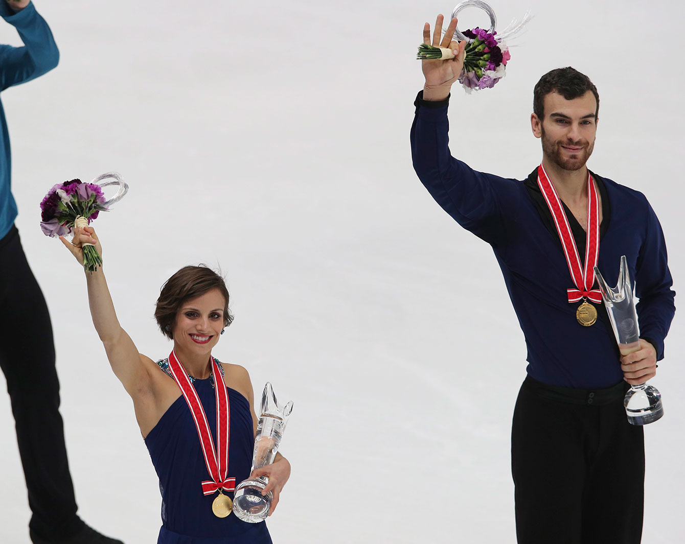 Meagan Duhamel and Eric Radford with their medals and first place awards at NHK Trophy (Grand Prix) on November 28, 2015. 