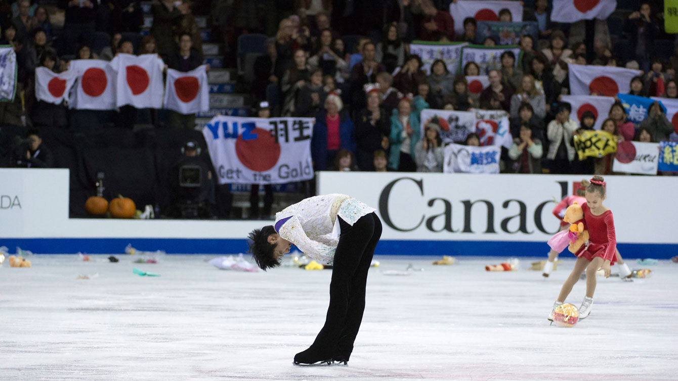Fans litter the ice in Lethbridge with gifts after Yuzuru Hanyu wraps up his competition with a technically superb free skate on October 31, 2015.
