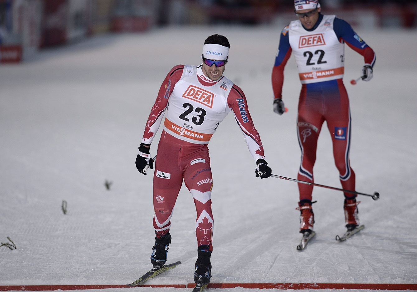 Alex Harvey edges Dario Cologna of Switzerland in Kuusamo, Finland to win World Cup skate-ski silver on November 28, 2015.