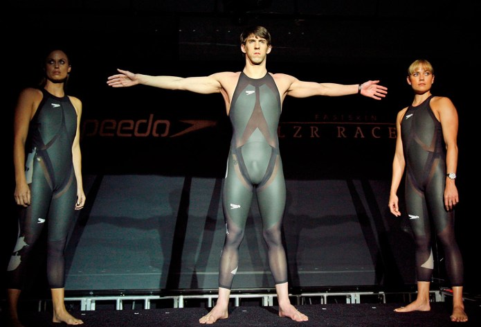 American swimmers Michael Phelps (centre), Amanda Beard (left), and Natalie Coughlin (right), show of Speedo's LZR Racer before Beijing 2008.
