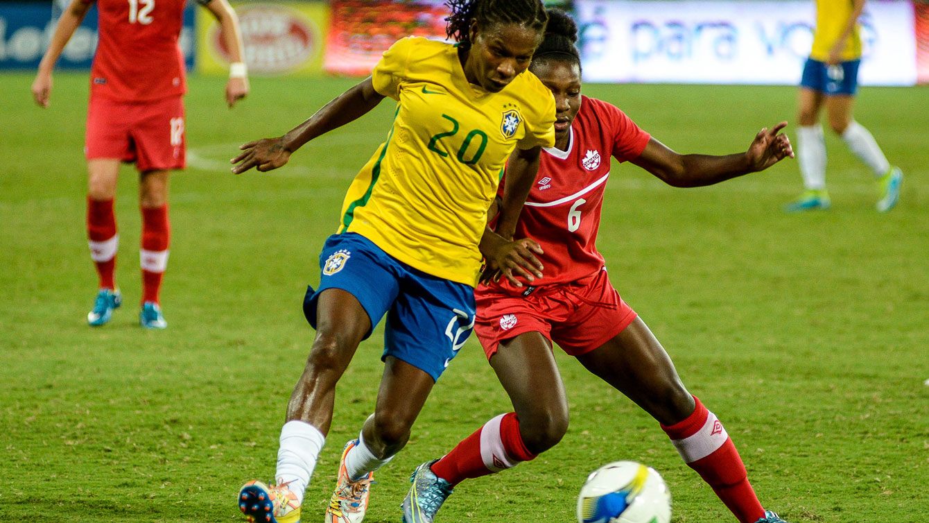 Deanne Rose (right in red), a 16-year old from Ontario, made her debut for Canada at the International Tournament of Natal. Rose appeared in the Natal invitational final against Brazil at the 64th minute (Photo: Vladimir Alexandre/Allsports).