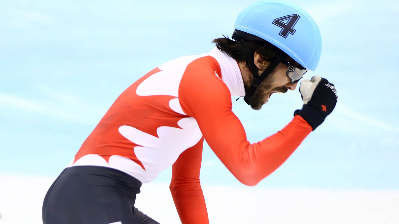 Charles Hamelin celebrates winning the men's 1500m final at the World Cup in Shanghai, China on December 12, 2015. 