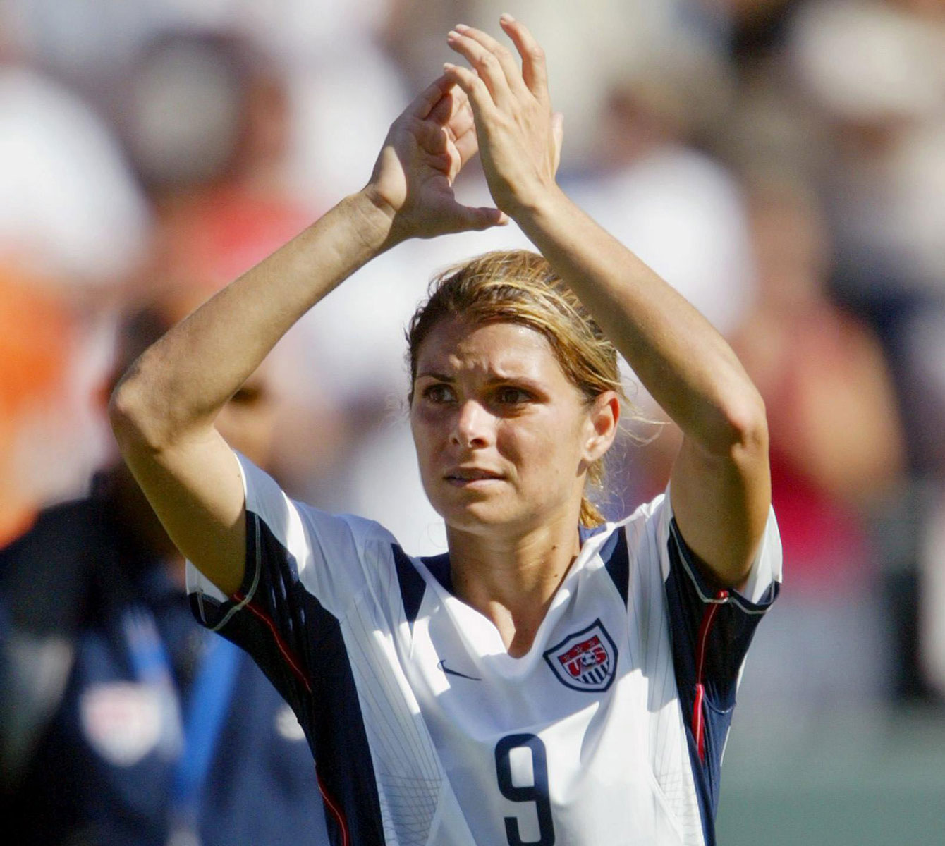 Mia Hamm applauds the crowd after the third place match at the FIFA Women's World Cup on October 11, 2003. USA beat Canada 3-1, in a match where Christine Sinclair scored the Canadian goal. On December 13, 2015, Sinclair tied Hamm for all-time goals with 158.