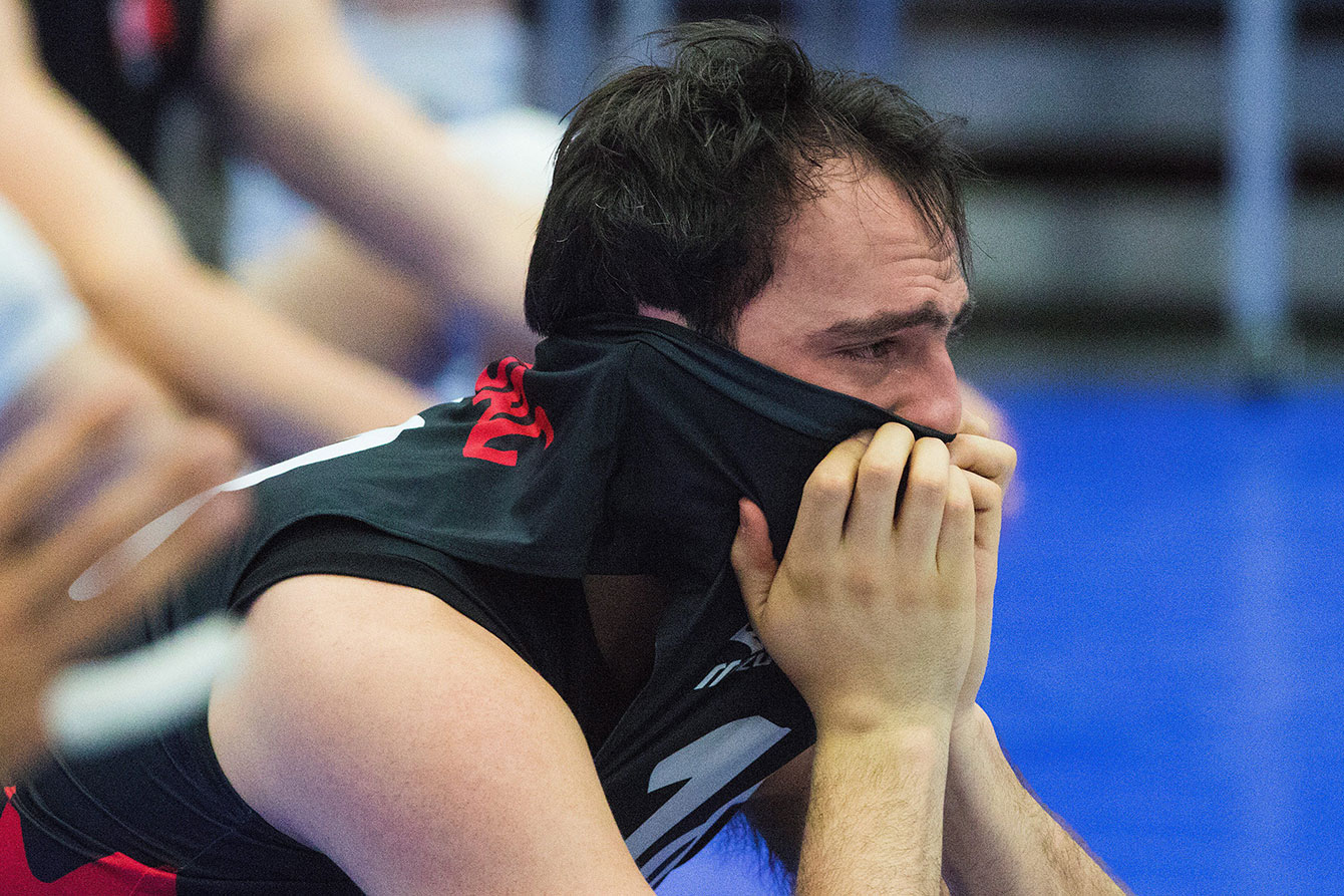 An emotional Nicholas Hoag partially buries his face following Canada's Olympic qualifying loss to Cuba in Edmonton on January 10, 2016. 