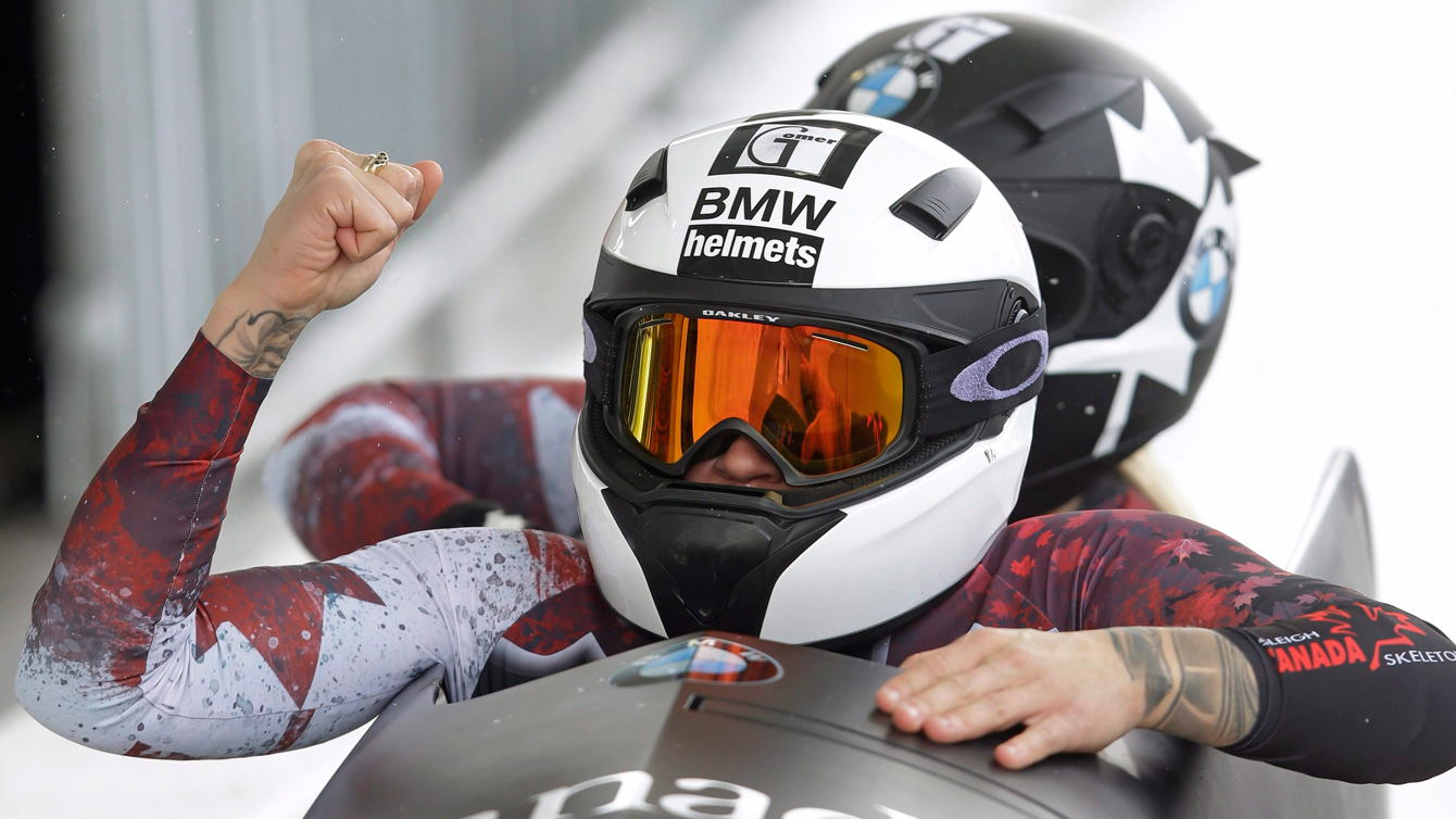 Kaillie Humphries, front, andMelissa Lotholz celebrate after competing in the women's bobsled World Cup race Friday, Jan. 15, 2016, in Park City, Utah.