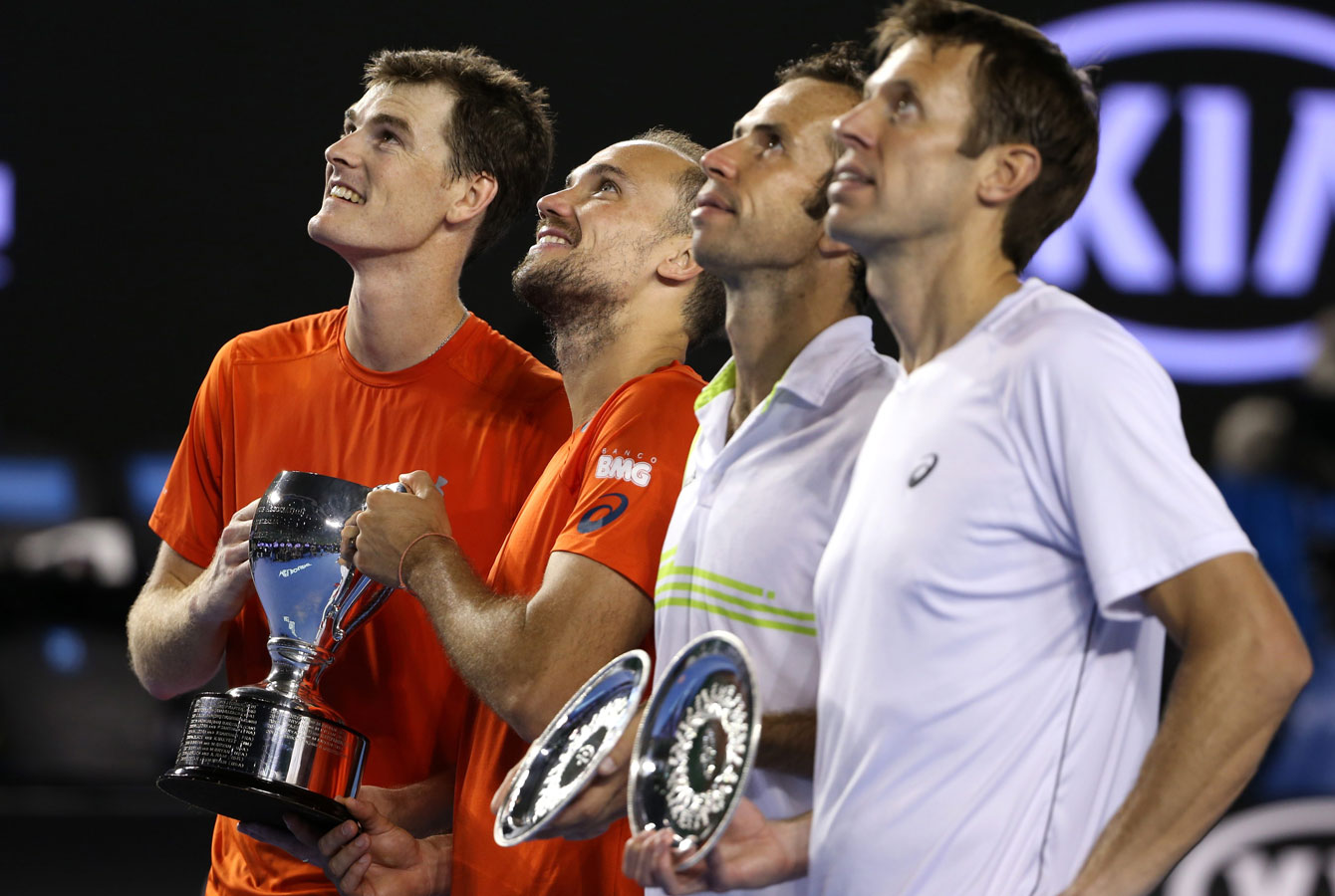 Daniel Nestor (right) holds the runner-up plate at the Australian Open after the men's doubles final on January 30, 2016. 