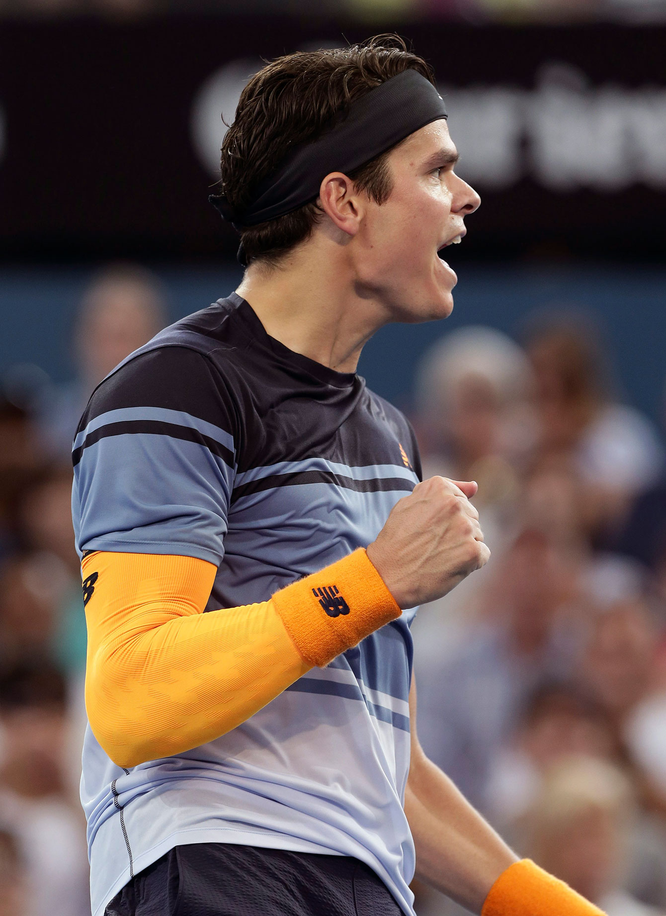 Milos Raonic celebrates in Brisbane after beating Bernard Tomic in the semifinals on January 9, 2016.