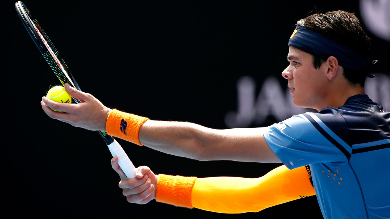 Milos Raonic at the Australian Open set to serve against Stan Wawrinka on January 25, 2016.