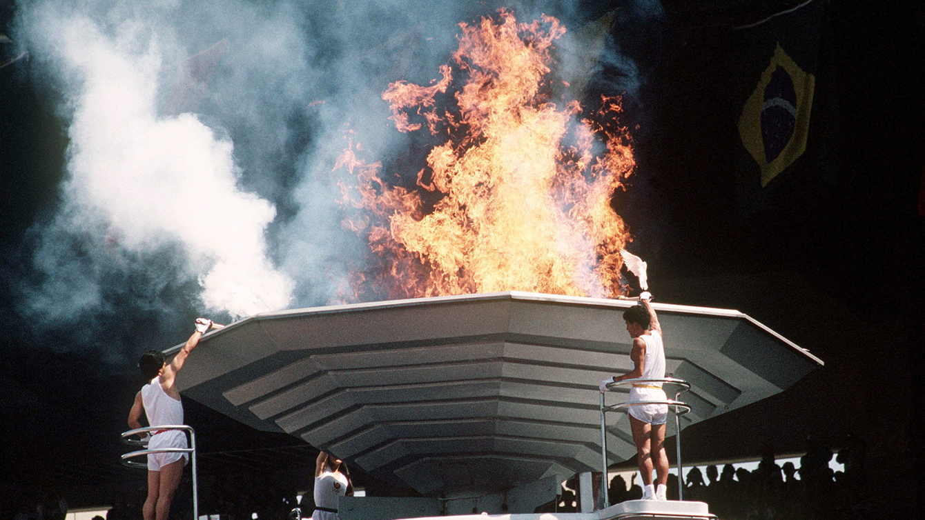 Torch bearers light the Olympic Flame during opening ceremonies at the 1988 Olympic games in Seoul.