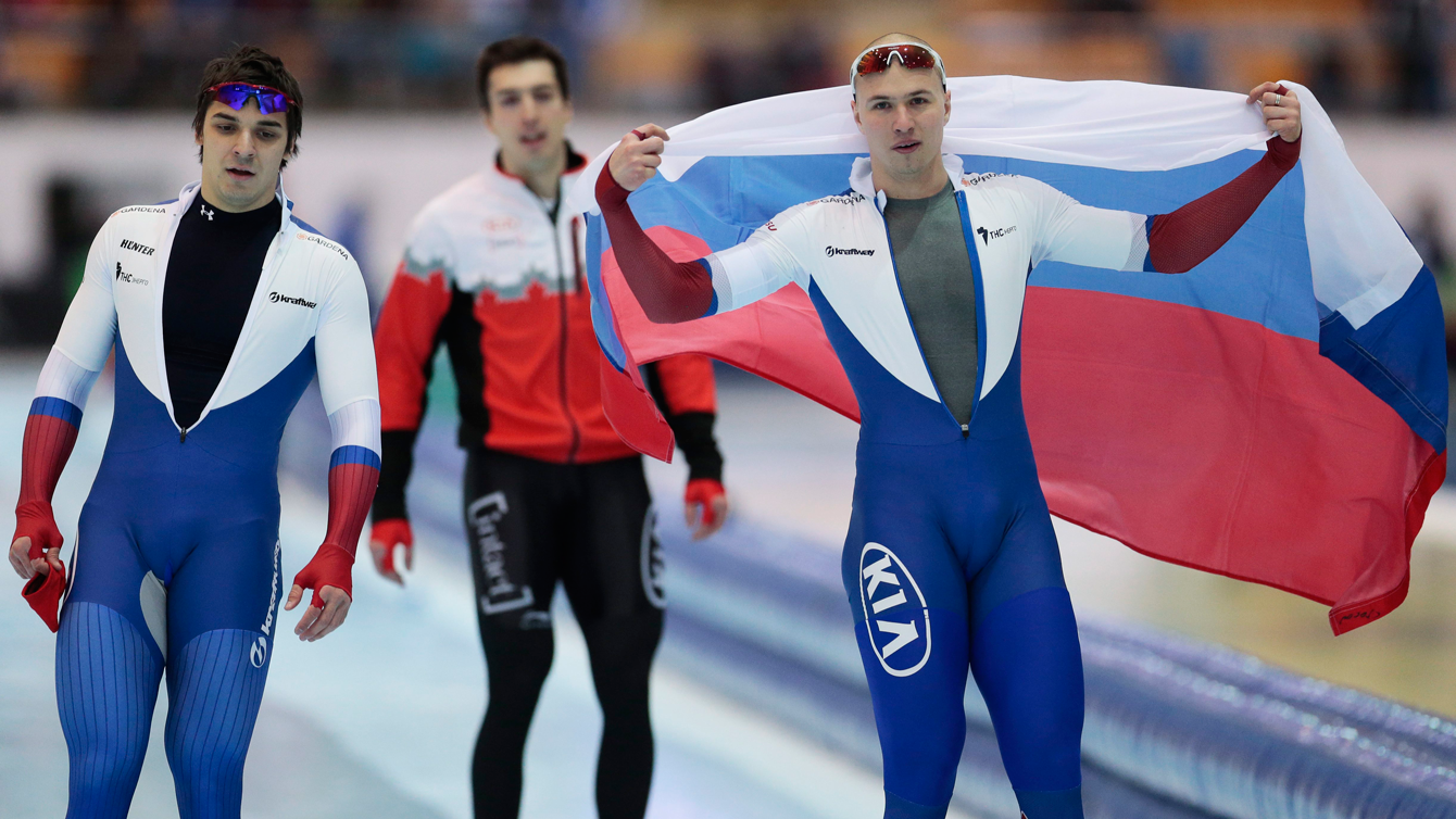 Canada's Alex Boisvert-Lacroix (centre), flanked by Russia's Pavel Kulizhnikov (right) and Ruslan Murashov, after second heat of the men's 500m race of the speed skating single distance world championships in Kolomna, Russia, on February 14, 2016. 